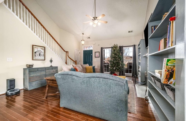 living room featuring dark hardwood / wood-style floors and ceiling fan