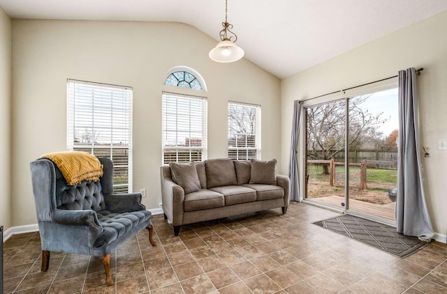 sitting room featuring plenty of natural light and vaulted ceiling