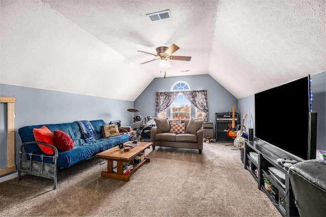 living room featuring carpet, ceiling fan, a textured ceiling, and vaulted ceiling