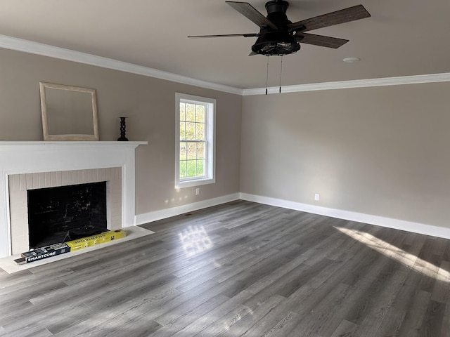 unfurnished living room with a fireplace, hardwood / wood-style floors, ceiling fan, and ornamental molding