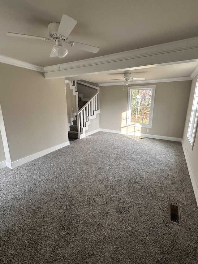 empty room featuring carpet floors, ceiling fan, and crown molding