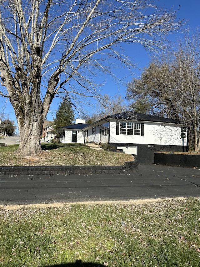 exterior space with a front yard