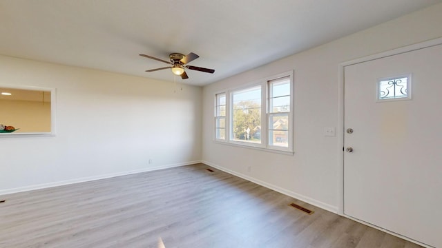 foyer entrance featuring light hardwood / wood-style floors and ceiling fan