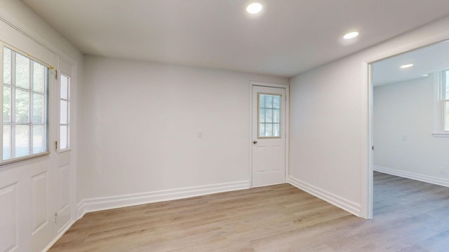 spare room with light wood-type flooring