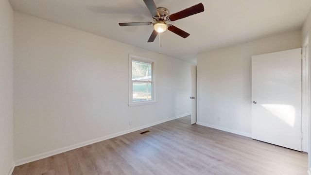 unfurnished room featuring light wood-type flooring and ceiling fan