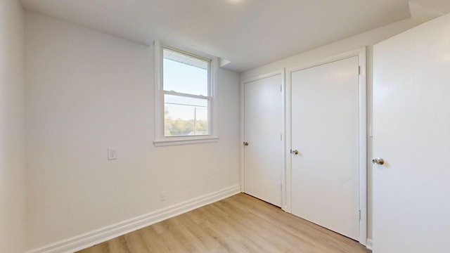 unfurnished bedroom with light hardwood / wood-style floors