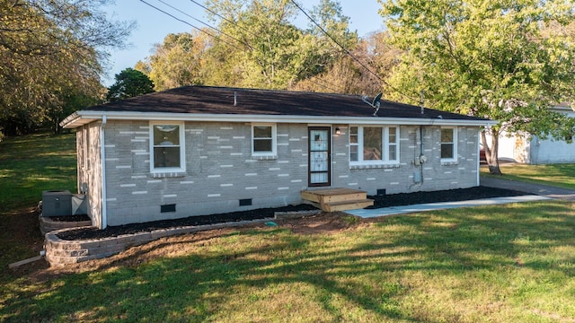 ranch-style home with a front yard