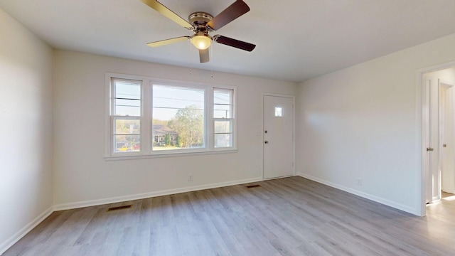 unfurnished room featuring ceiling fan and light hardwood / wood-style floors