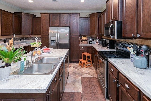 kitchen with dark brown cabinetry, sink, appliances with stainless steel finishes, and ornamental molding