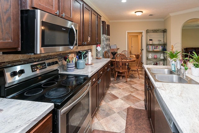 kitchen with dark brown cabinetry, sink, stainless steel appliances, backsplash, and crown molding