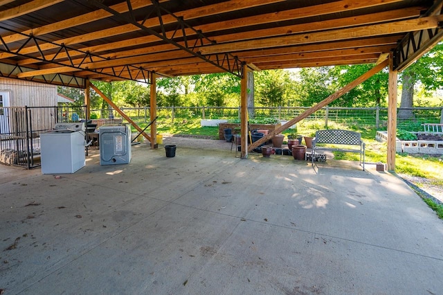 view of patio featuring washer / dryer and an outdoor structure