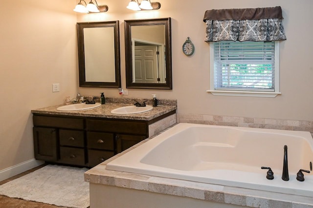 bathroom featuring a bathtub and vanity