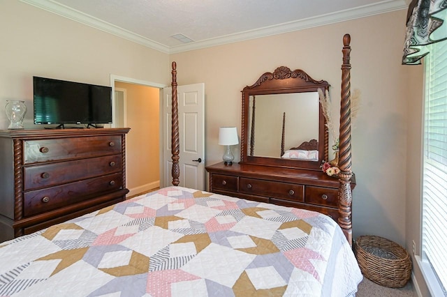 carpeted bedroom with ornamental molding