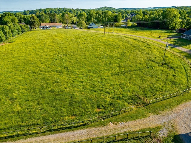 birds eye view of property with a rural view