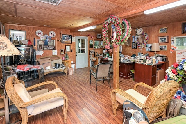 home office featuring hardwood / wood-style flooring, wood ceiling, and wooden walls