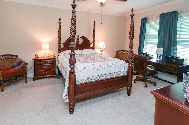 carpeted bedroom with ceiling fan and ornamental molding