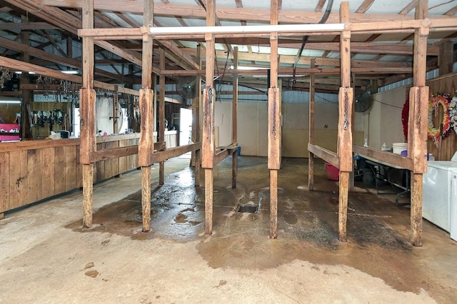 basement featuring washer / clothes dryer and water heater