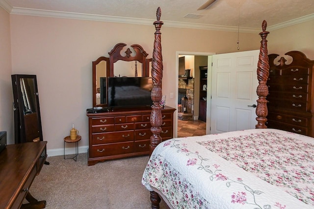 bedroom with a fireplace, light colored carpet, ceiling fan, and ornamental molding