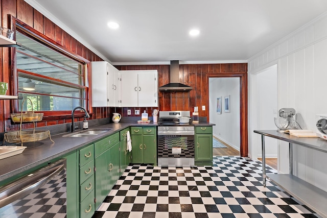 kitchen with ornamental molding, stainless steel appliances, beverage cooler, sink, and wall chimney range hood