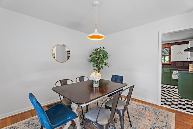 dining room with hardwood / wood-style floors