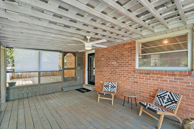 wooden terrace featuring ceiling fan