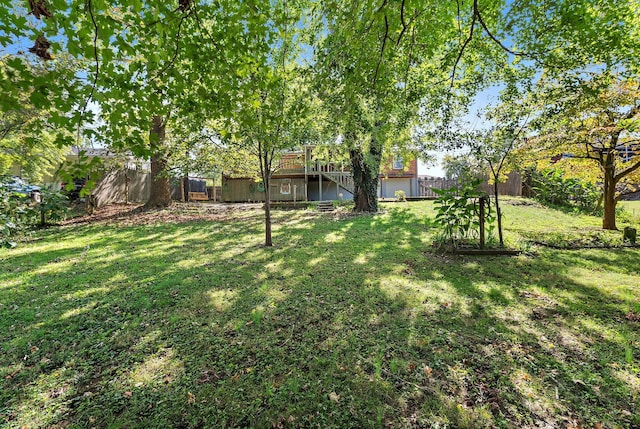 view of yard with a wooden deck