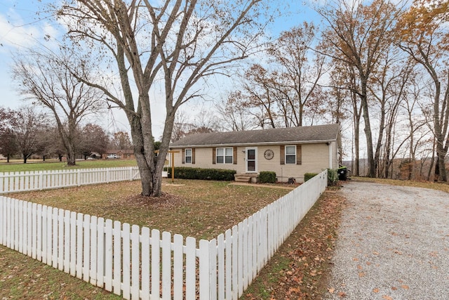 ranch-style home featuring a front yard