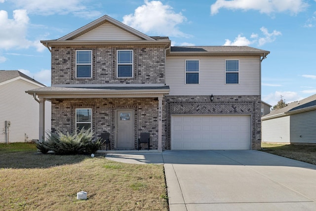 view of front property featuring a garage and a front lawn