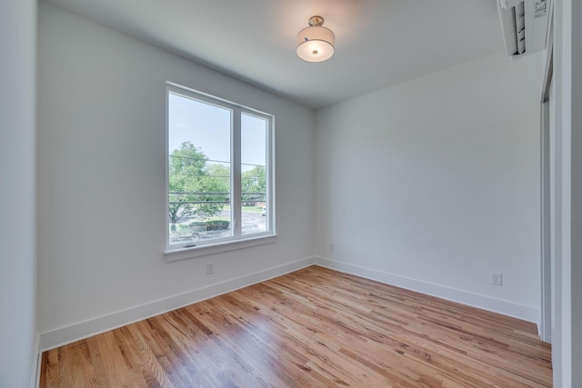 spare room with light wood-type flooring