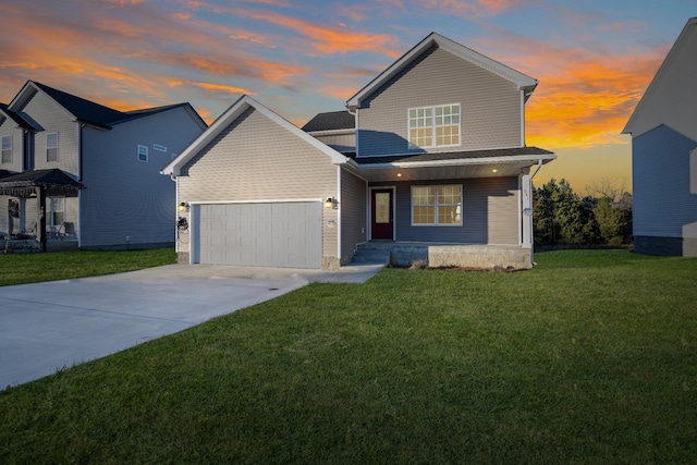 view of front facade with a lawn and a garage