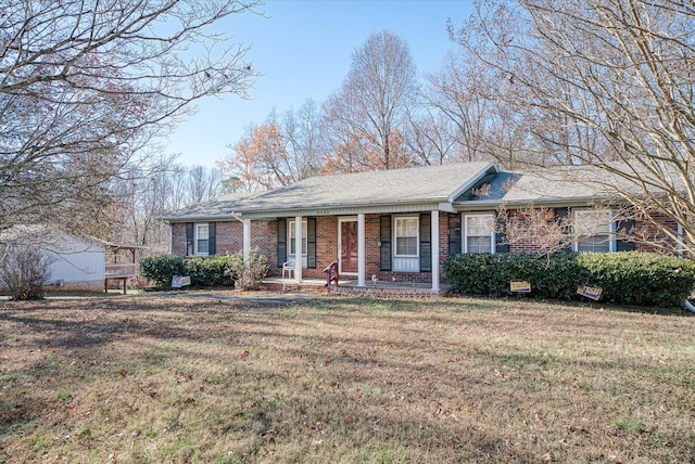 ranch-style house featuring a porch and a front lawn