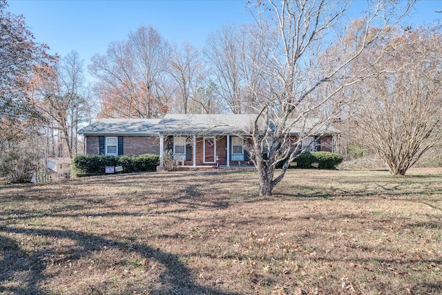 ranch-style house with a porch and a front lawn