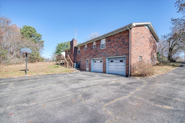 view of side of home with a garage