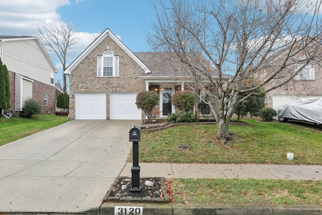 view of front of house with a garage and a front lawn