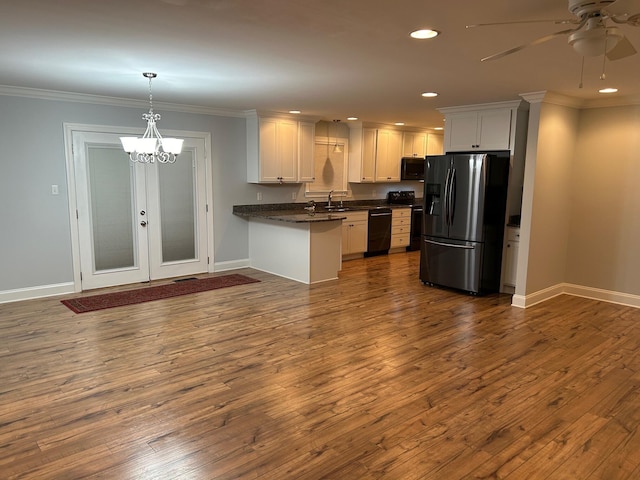 kitchen with black appliances, white cabinetry, kitchen peninsula, and dark wood-type flooring