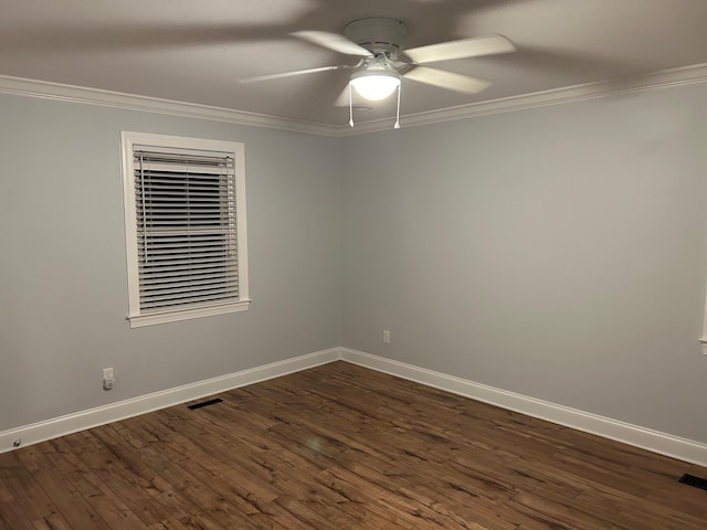 unfurnished room featuring ceiling fan, dark wood-type flooring, and ornamental molding