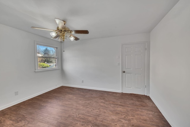 unfurnished room with dark hardwood / wood-style floors and ceiling fan