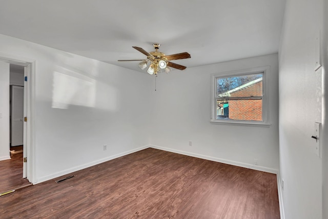 unfurnished room with dark hardwood / wood-style floors and ceiling fan