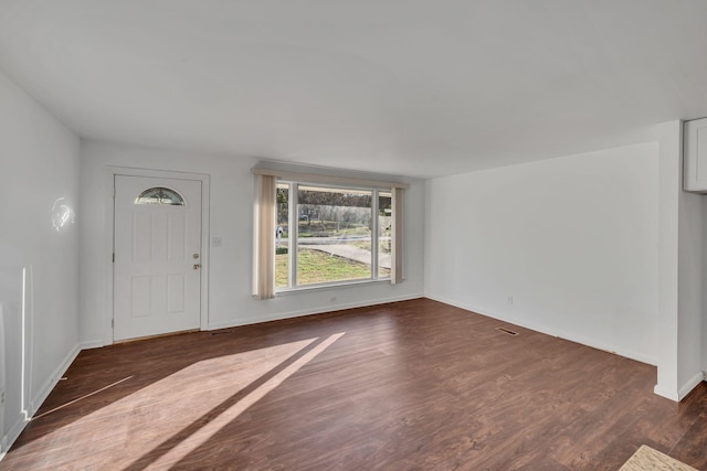 entrance foyer featuring dark hardwood / wood-style floors