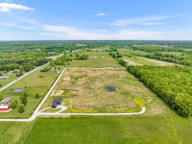 birds eye view of property featuring a rural view