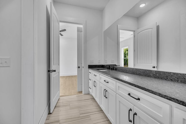 bathroom with vanity and hardwood / wood-style flooring