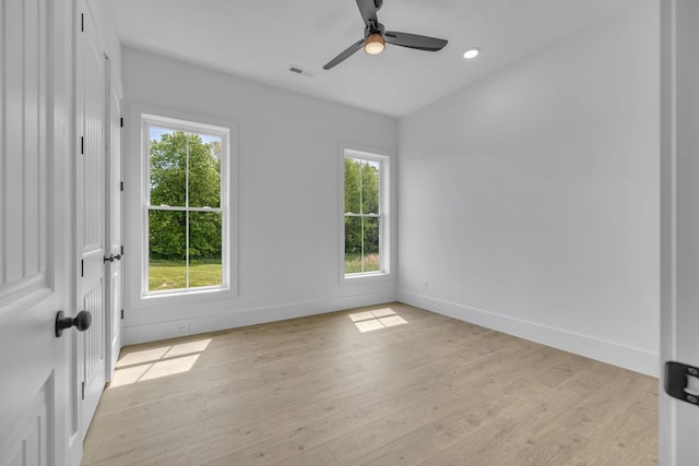 unfurnished room featuring ceiling fan and light hardwood / wood-style floors