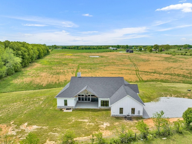 birds eye view of property featuring a rural view