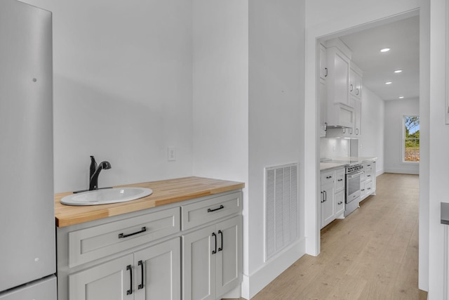 bathroom featuring hardwood / wood-style flooring and sink