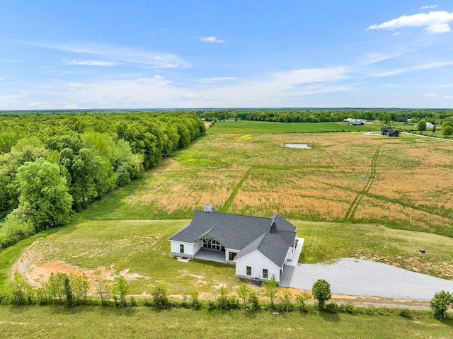 birds eye view of property with a rural view