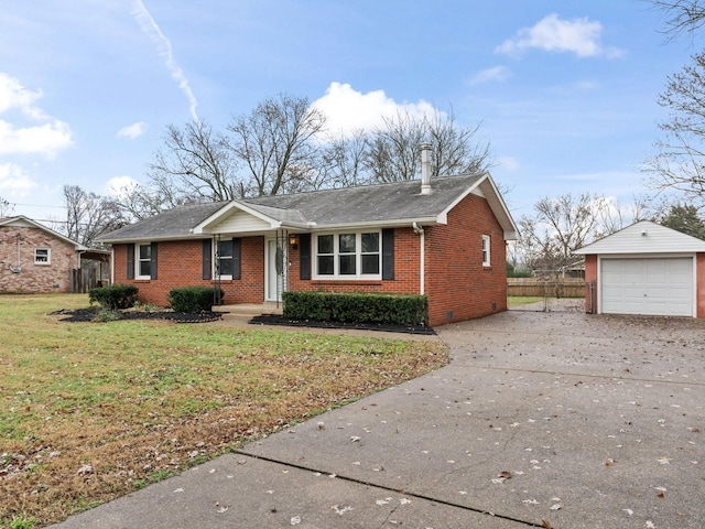 view of front facade with a front yard, an outdoor structure, and a garage