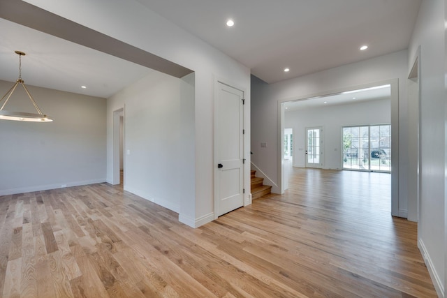 unfurnished room with light wood-type flooring