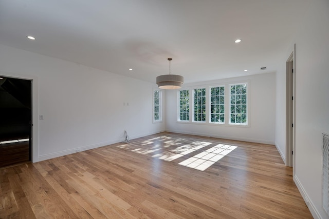 unfurnished living room with light wood-type flooring