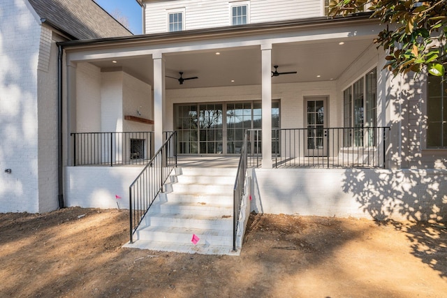 entrance to property with ceiling fan