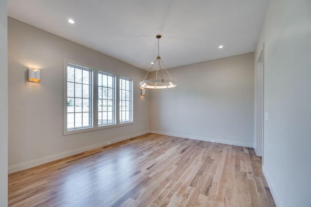 spare room featuring light wood-type flooring